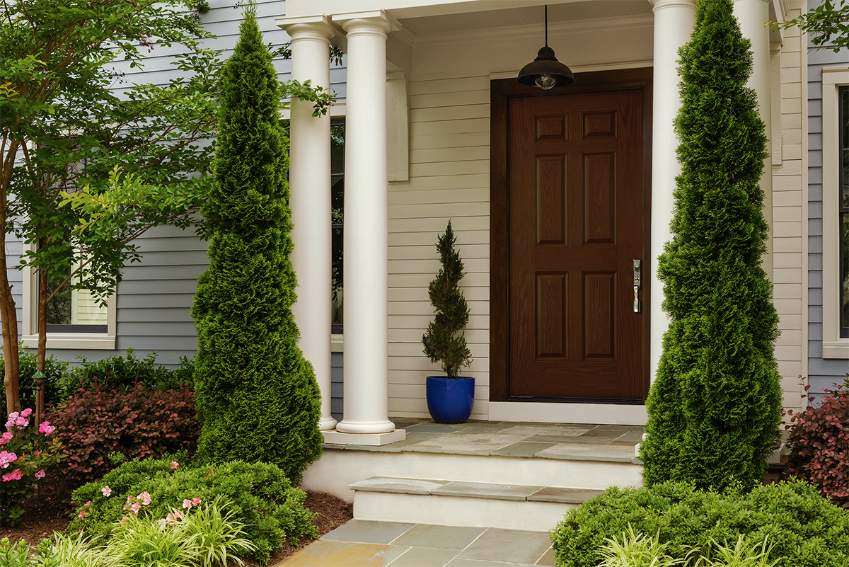 Woodgrain door in covered porch area